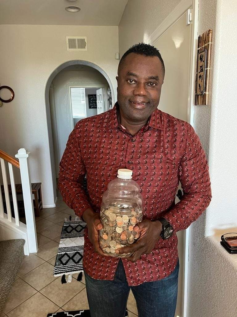 photo of a man with change jar