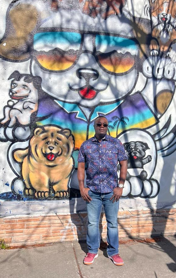 photo of a man next to a water fountain