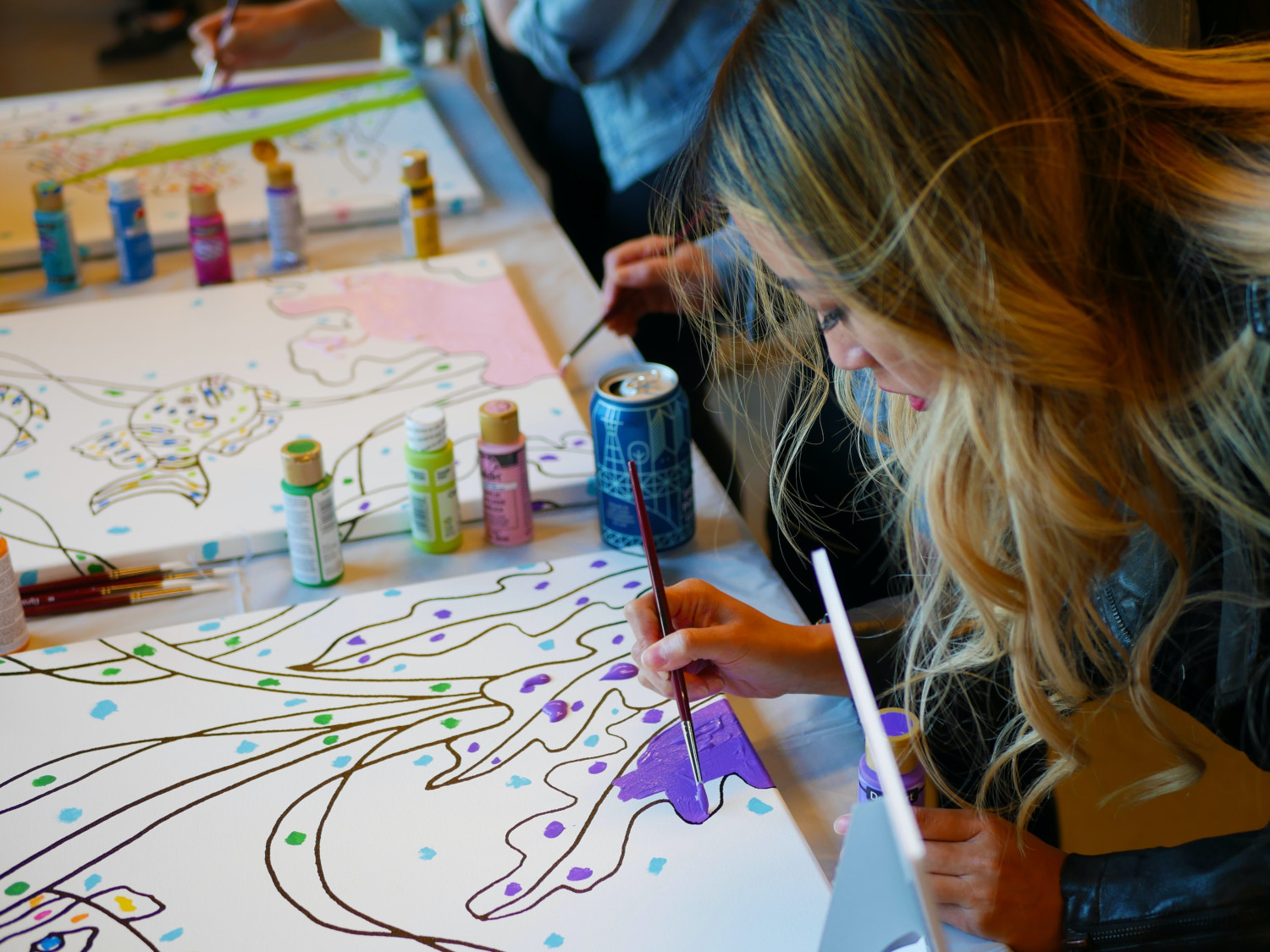 a woman painting a picture
